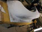Block sanding primer-surfacer in process, one of multiple coats